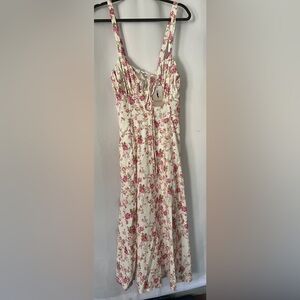 Women’s EFOGEP Floral Dress. There is no tags to indicate the size or material.